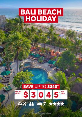 Bali beach holiday | save up to $340* - return from $3,045* for two. Wide shot of a hotel pool by the beach