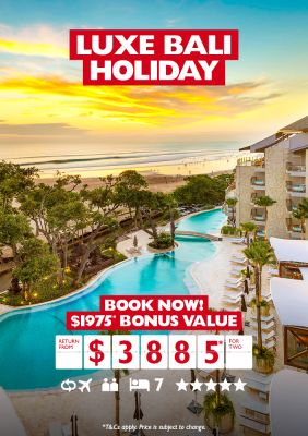 Luxe Bali holiday | book now! $1,975* bonus value. Return from $3,885* for two. Wide shot of a hotel and pool along a beachfront under a cloudy sunset