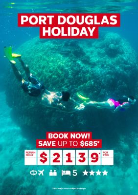 Port Douglas holiday | book now! Save up to $685* - return from $2,139* for two | Couple snorkelling next to a large coral formation