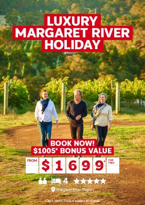 Luxury Margaret River holiday - book now! | $1,005* bonus value from $1,699* for two. Three people walking through a wine vineyard in the late afternoon