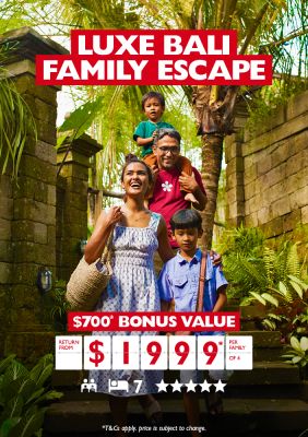 Luxe Bali family escapes | $700* bonus value. Return from $1,999* per family of 4. Family walking through a jungle and old stone buildings