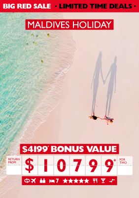 Maldives holiday. $4,199* bonus value return from $10,799* for two. Overhead shot of couple walking hand in hand on a bright white beach