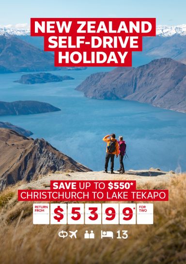New Zealand self-drive holiday | save up to $550*. Christchurch to Lake Tekapo. Return from $5,399* for two. Backpackers looking out at rolling hills and rivers in New Zealand