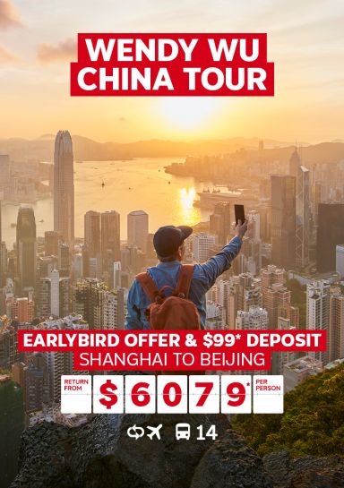 Wendy Wu China Tour | Earlybird off & 99* deposit. Shanghai to Beijing - return from $6,079* per person. Person taking a selfie from a cliff with the city of Shanghai in the background at sunset