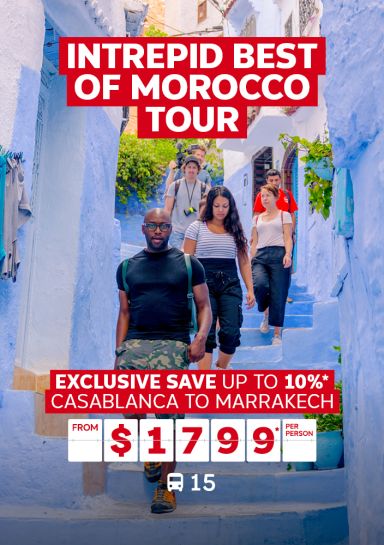 Intrepid best of Morocco tour | Exclusive save up to 10%* - Casablanca to Marrakech - from $1,799* per person. People walking down blue stairs
