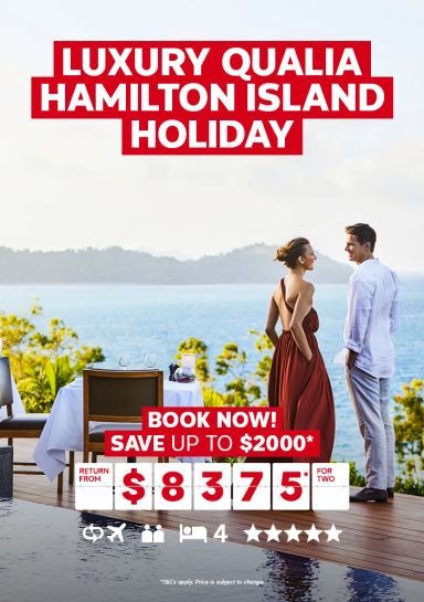 Luxury Qualia Hamilton Island holiday | book now! - Save up to $2,000* | return from $8,375* for two. Couple in formal clothing sharing wine at a table overlooking the ocean