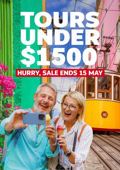 Tours under $1500* hurry, sale ends 15 May! - Couple taking a selfie with a yellow tram in the background