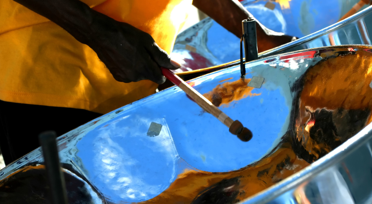 Person playing steel pan 