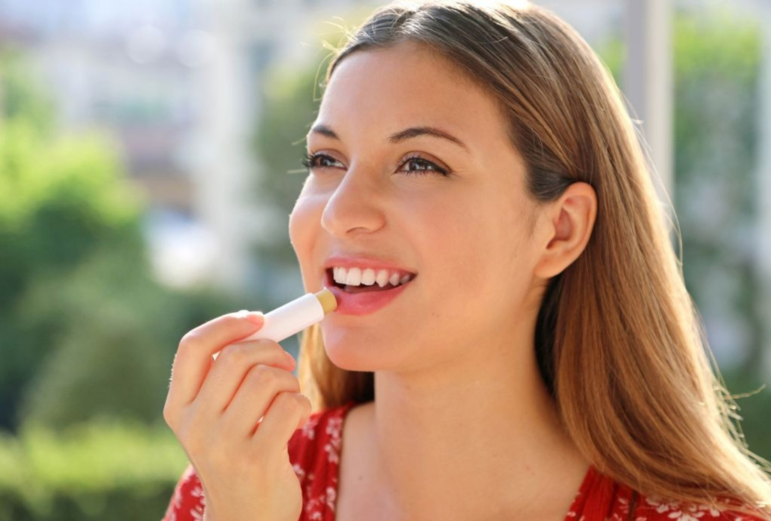 Image of someone applying lip balm