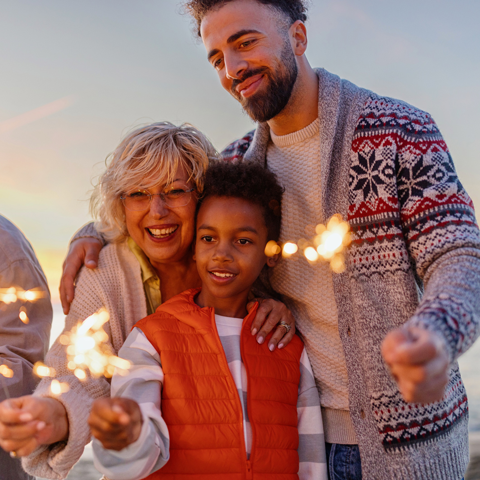 Family Lighting Sparklers during Christmas Holiday Season