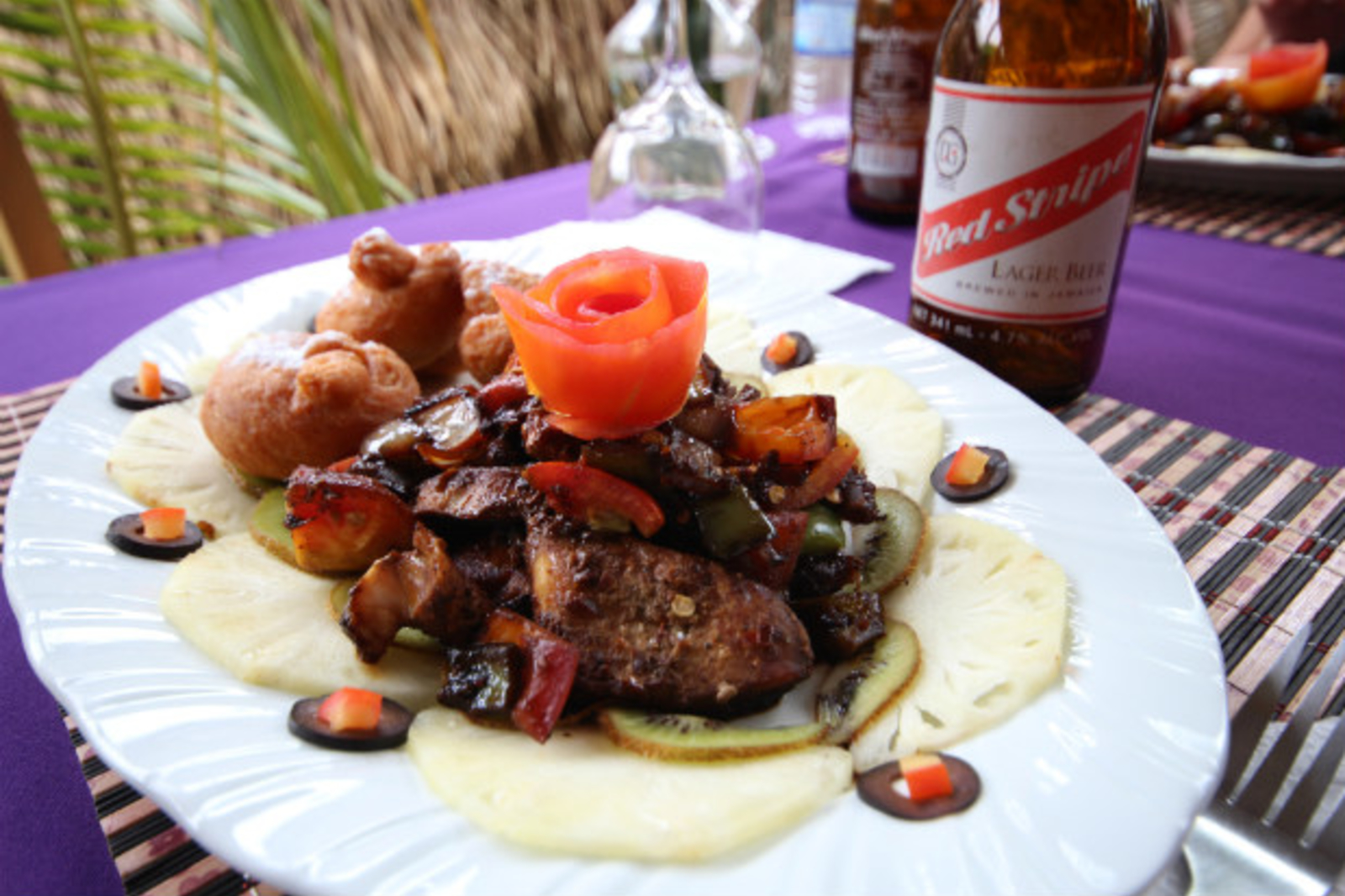 Traditional Jamaican cuisine with red wine