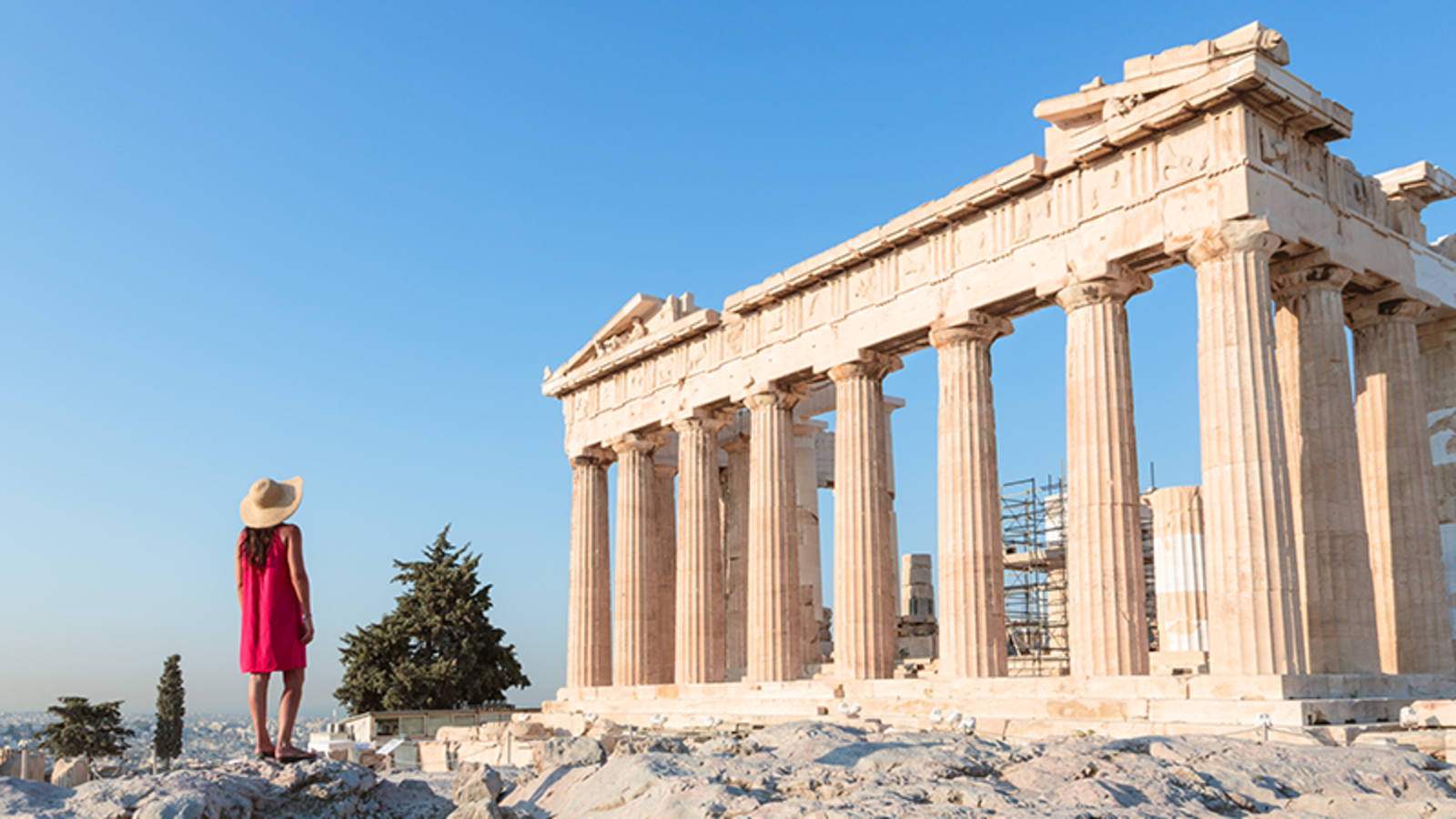 The Acropolis of Athens, framed by a bright blue sky