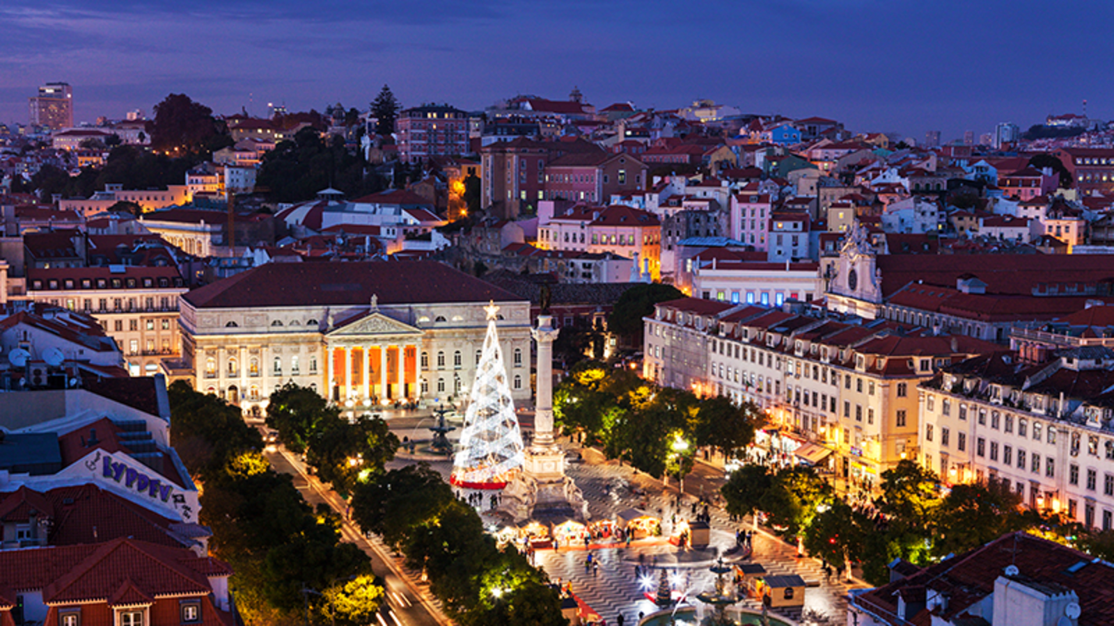 Christmas in Lisbon - the city square lit up by a white Christmas tree
