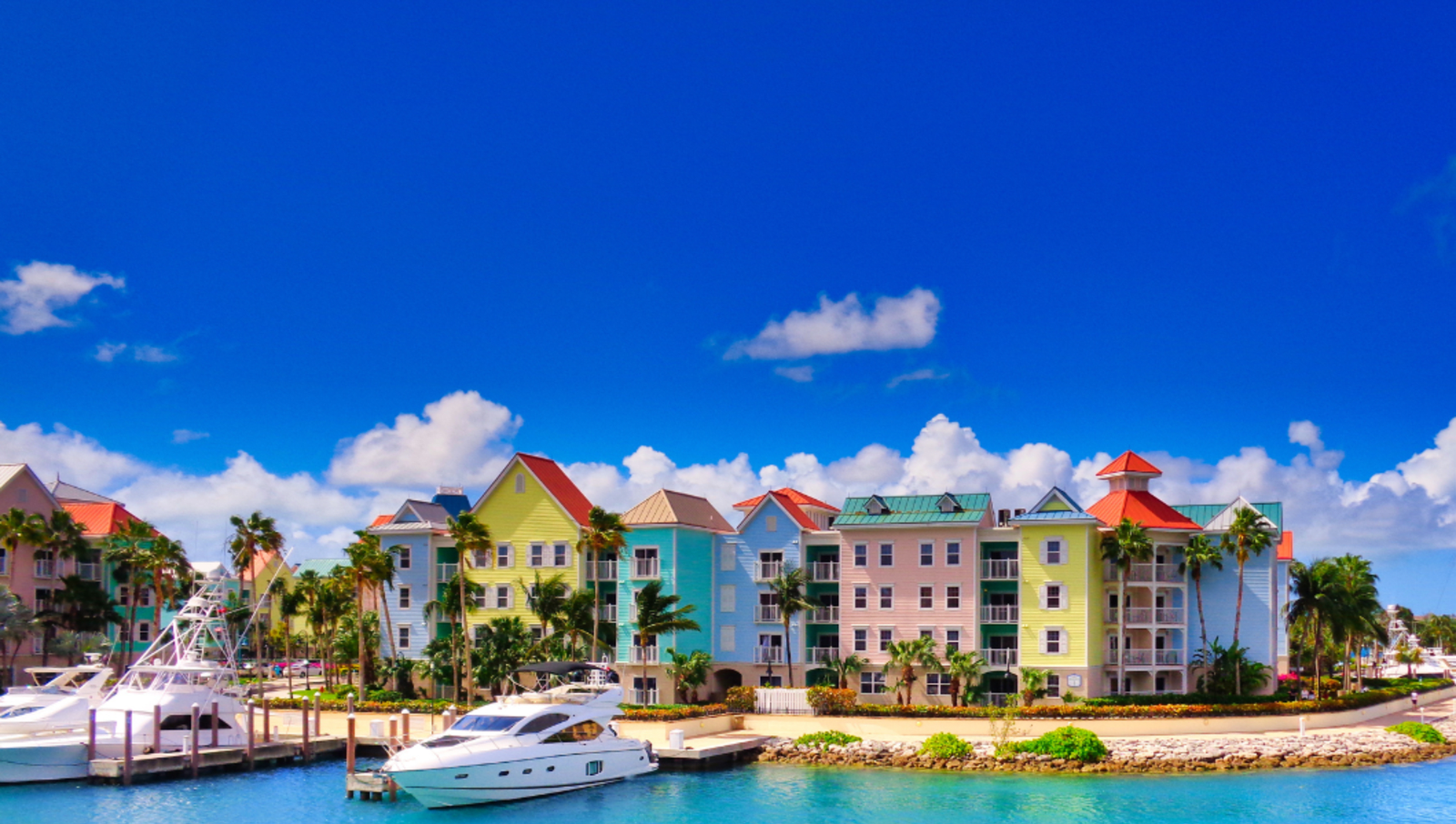 Colourful houses and boats along the water in Nassau Bahamas