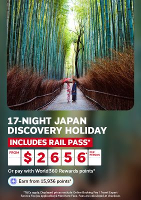 Couple in kimono holding a red umbrella in a towering bamboo forest for a 17 night Japan discovery holiday including rail pass from 2656 per person