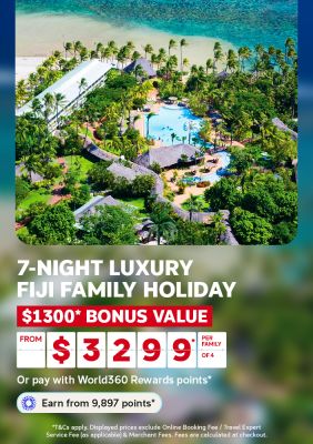 Aerial view of a resort with pools and huts near a Fiji beach for a 7 night luxury family holiday with 1300 bonus value from 3299 per family of 4