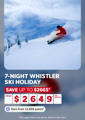 Skier carving through deep powder snow on a steep Whistler mountain run for a 7-night ski holiday saving up to $2665 from $2649 per person