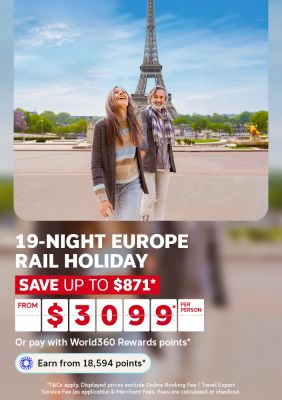 Couple laughing together near the Eiffel Tower in Paris for a 19 night Europe rail holiday saving up to 871 from 3099 per person