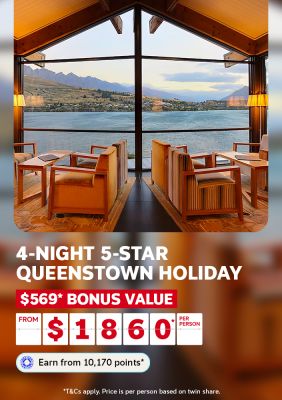 Lounge chairs overlooking Lake Wakatipu through floor to ceiling windows for a 4-night 5-star Queenstown holiday with 569 dollar bonus value from 1860