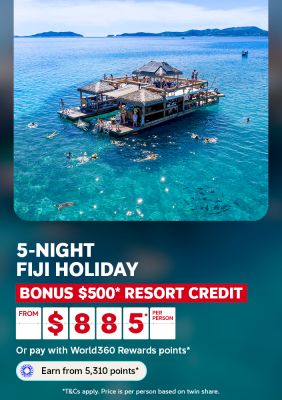 People swimming around a thatched roof pontoon in turquoise Fiji waters for a 5-night holiday with $500 resort credit from $885 per person