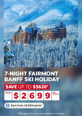 Snow covered Fairmont hotel surrounded by frosted pines beneath the Banff mountains for a 7-night ski holiday saving up to $3620 from $2699 per person