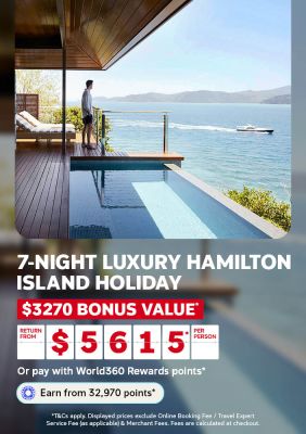 Man overlooking the ocean from a private pool with a yacht passing by for a 7 night luxury Hamilton Island holiday with 3270 bonus value from 5615