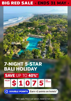 Aerial view of a lush 5-star Bali resort with a turquoise pool beside a palm-fringed beach for a 7-night holiday saving up to 40% from $1075 per person
