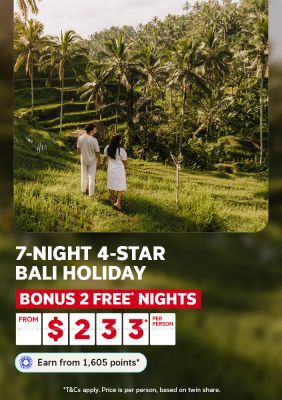Couple walking hand in hand through lush Bali rice terraces for a 7-night 4-star holiday with 2 bonus free nights from $233 per person