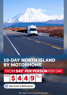 Motorhome on an open road toward a snow-capped New Zealand volcano for a 10-day North Island motorhome trip from $45 per person per day from $449 per person