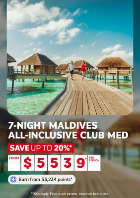   Couple on an overwater boardwalk above turquoise Maldives waters for a 7-night all-inclusive Club Med stay saving up to 20% from $5539 per person