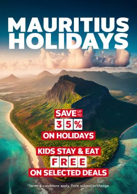 Aerial view of Mauritius with dramatic mountain peaks and turquoise lagoons featuring holidays saving up to 35% and kids stay and eat free