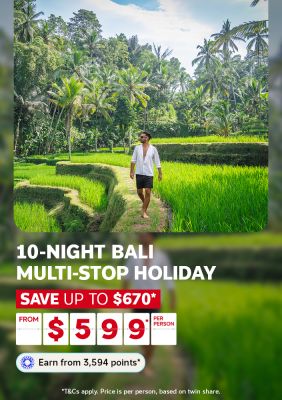 Person strolling through lush green Balinese rice terraces for a 10-night Bali multi-stop holiday saving up to $670 from $599 per person