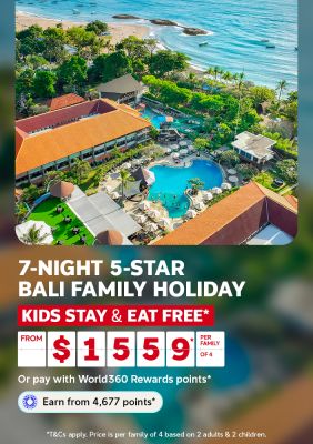 Aerial view of a beachfront resort with pools and waterslide for a 7-night Bali family holiday kids stay and eat free from $1559 per family of 4