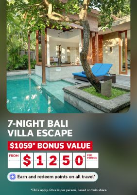 Private Bali villa with a serene pool shaded by a tree and blue sun loungers for a 7-night villa escape with $1059 bonus value from $1250 per person