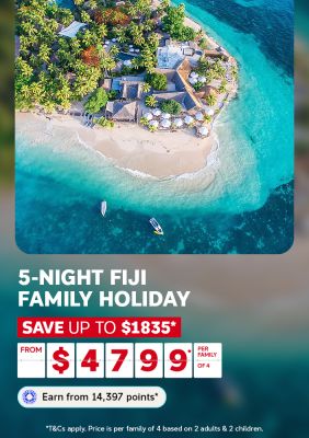   Aerial view of a palm fringed island resort surrounded by turquoise water for a 5-night Fiji family holiday saving up to $1835 per family of 4