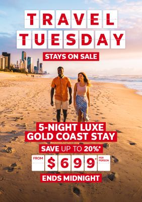 Travel Tuesday - stays on sale | 5-night Luxe Gold Coast stay - save up to 20%*. From $699* per person | Ends midnight | Couple walking on the beach at sunset