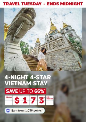 Travel Tuesday - ends midnight | 4-night 4-star Vietnam stay | save up to 66%* - from $173* per person | Earn from 1,038 points* | Woman walking through a temple in Vietnam