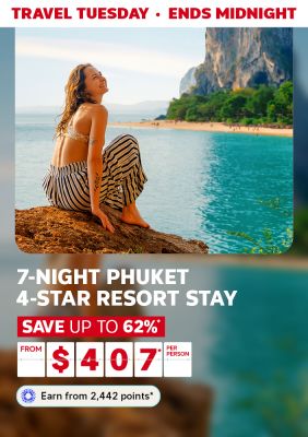 Travel Tuesday - ends midnight | 7-night Phuket 4-star resort stay | Save up to 62%* - from $407* per person | Earn from 2,442 points* | Woman relaxing on a rock looking out at the ocean