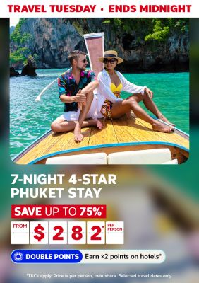 Travel Tuesday - ends midnight | 7-night, 4-star Phuket stay. Save up to 75%* - from $282* per person. Double Points - Earn 2x points on hotels* | *T&Cs apply. Price is per person, twin share. Selected travel dates only. | Couple sitting on a boat with limestone mountains in the background