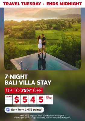 Couple at infinity pool overlooking lush Bali rice paddies for Travel Tuesday 7-night villa stay up to 75% off from $545 per person