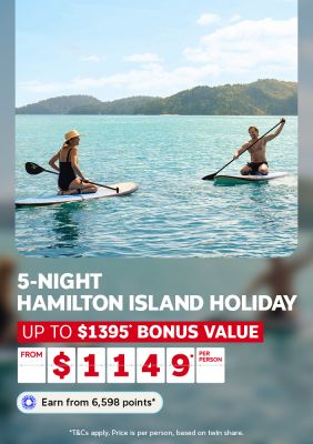 Two people on stand-up paddleboards featuring a 5-night Hamilton Island holiday with up to $1395 bonus value from $1149 per person