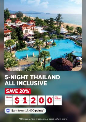 5-night Thailand all inclusive | save 20%* from $1,200* per person | Earn from 14,400 points* | *T&Cs apply. Price is per person, based on twin share. | Wide shot of a hotel in Thailand next to the beach