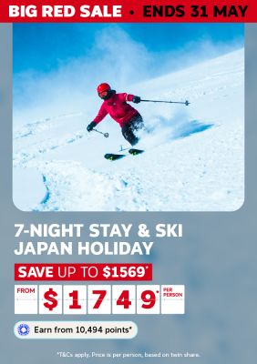 Skier carving through deep powder on a Japan mountain for a Big Red Sale 7-night Stay and Ski Japan holiday saving up to $1569 from $1749 per person