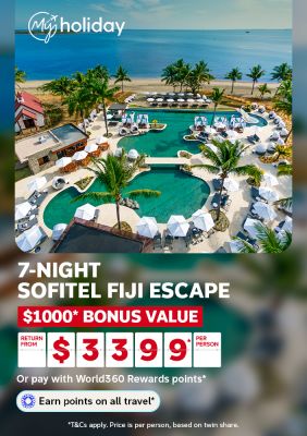 Aerial view of a resort pool complex beside a palm-fringed Fiji beach for a 7-night Sofitel Fiji escape with $1000 bonus value from $3399 per person