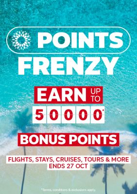 Palm tree shadows cast over a turquoise shoreline for a points frenzy earning up to 50000 bonus points on flights stays cruises and tours