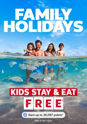 Family of four playing in the ocean featuring family holidays where kids stay & eat free