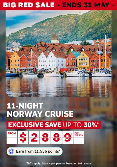 Colourful Bryggen wharf buildings reflected in Bergen harbour for a Big Red Sale 11-night Norway cruise saving up to 30% from $2889 per person