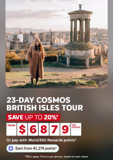Woman standing before a monument overlooking the Edinburgh skyline for a 23-day Cosmos British Isles tour saving up to 20% from $6879 per person