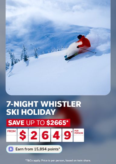 Skier carving through deep powder snow on a steep Whistler mountain run for a 7-night ski holiday saving up to $2665 from $2649 per person