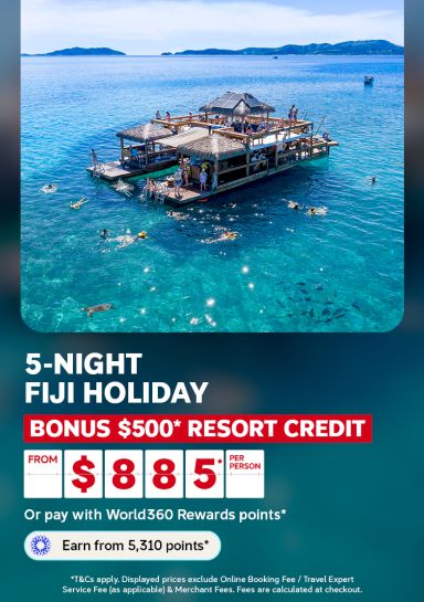 Swimmers around an overwater platform in clear Fiji lagoon waters for a 5 night Fiji holiday with 500 dollars bonus resort credit from 885 per person